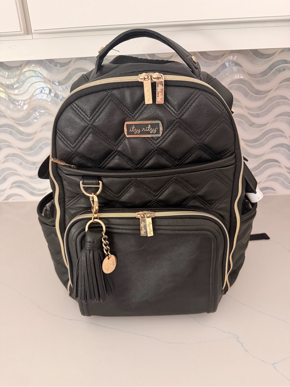 Itzy Ritzy Black Quilted Backpack with Gold Accents